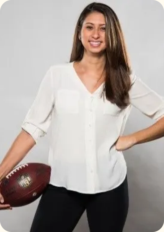Portrait of Danielle Marks holding a football